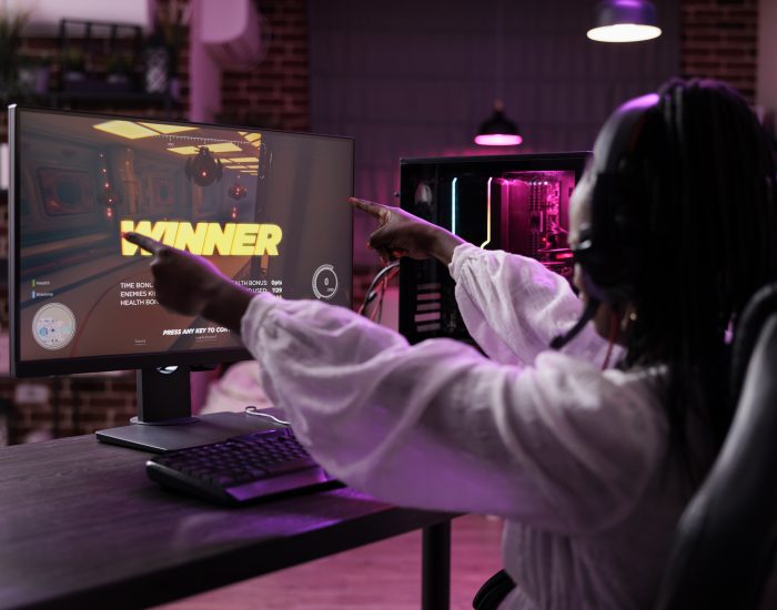 woman-streamer-playing-video-games-tournament-computer-celebrating-win-female-player-winning-action-gaming-championship-having-fun-with-online-gameplay-competition-pc